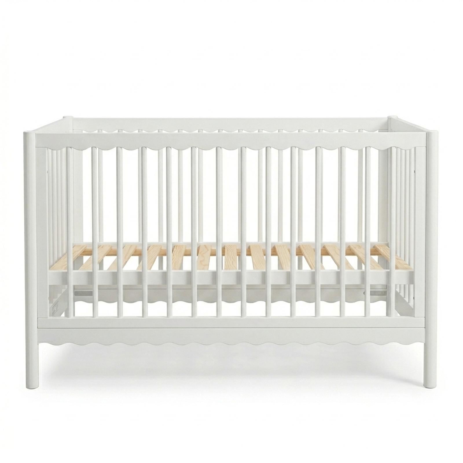White crib with natural wood slats on a white background