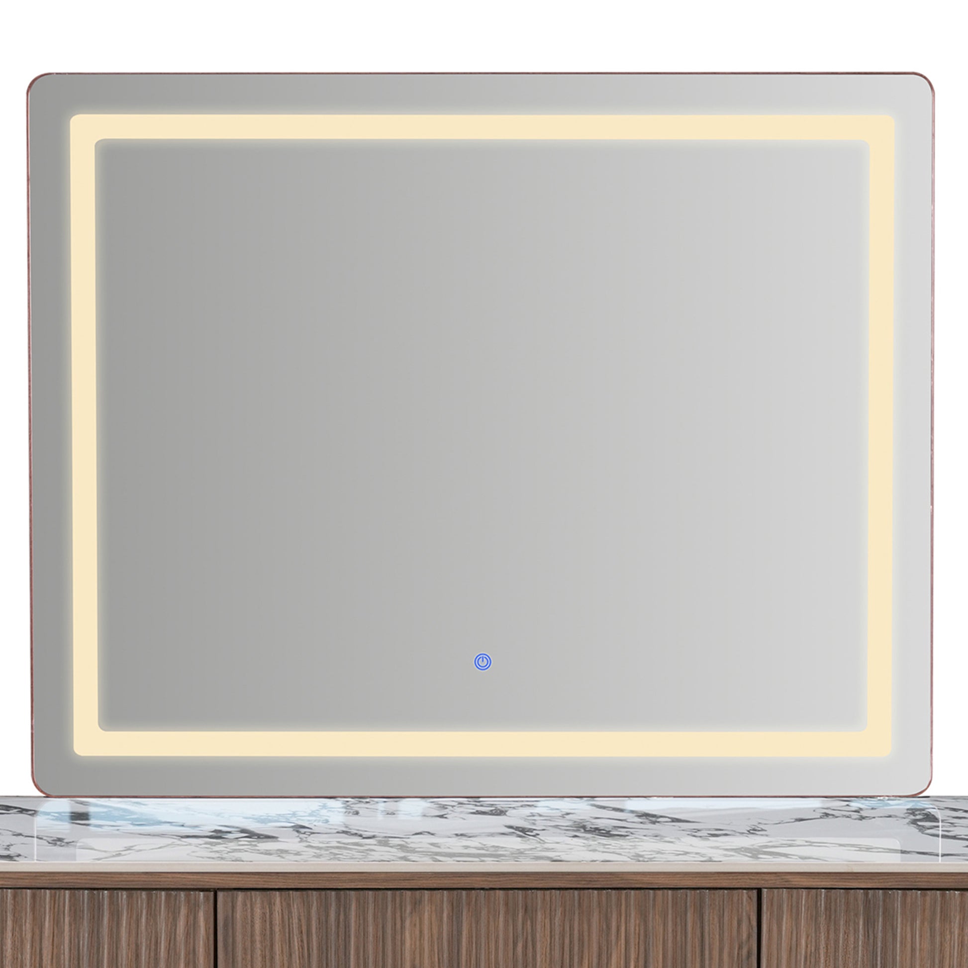 Rectangular illuminated mirror above a vanity countertop