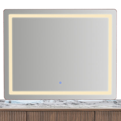 Rectangular illuminated mirror above a vanity countertop