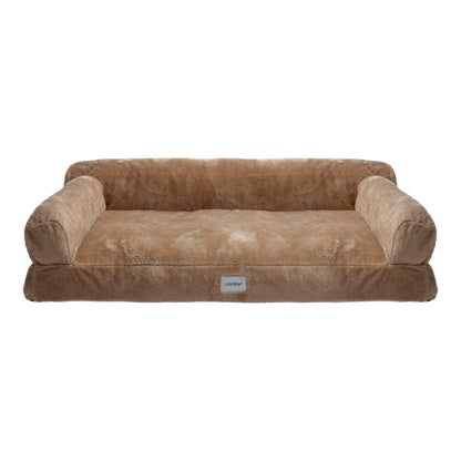 Plush tan dog bed with raised bolsters on white background