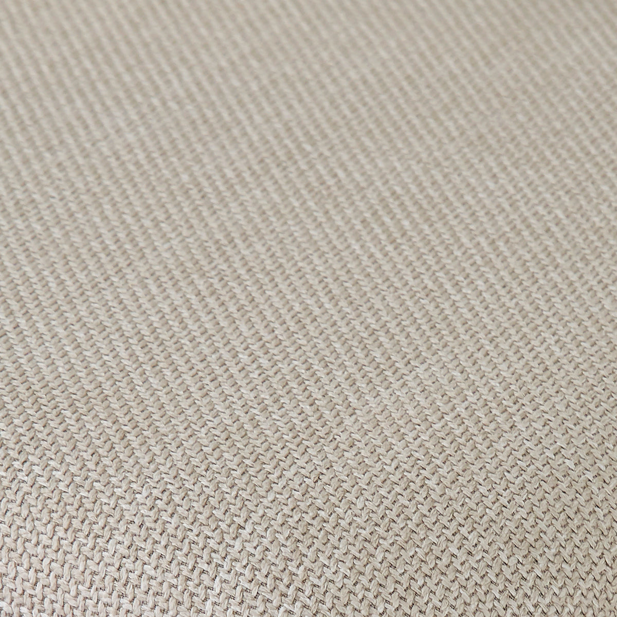 Close-up of beige woven upholstery fabric texture