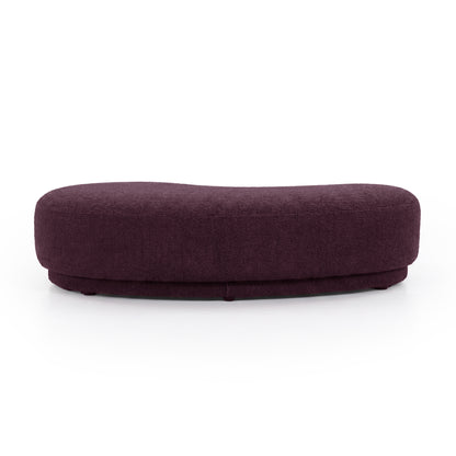 Rounded rectangular plum upholstered  bench seat on a white background