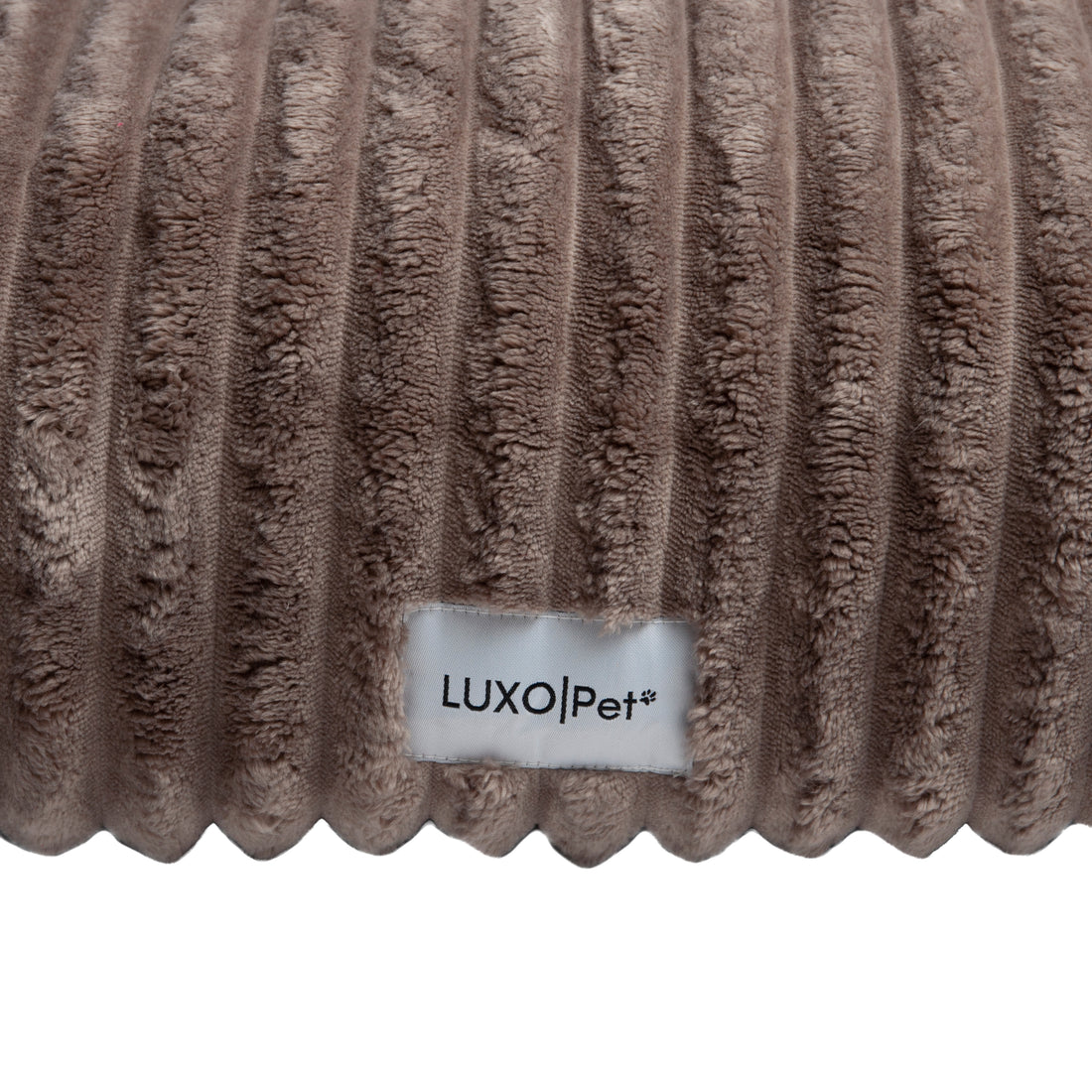 Close-up ribbed fabric texture with brand label