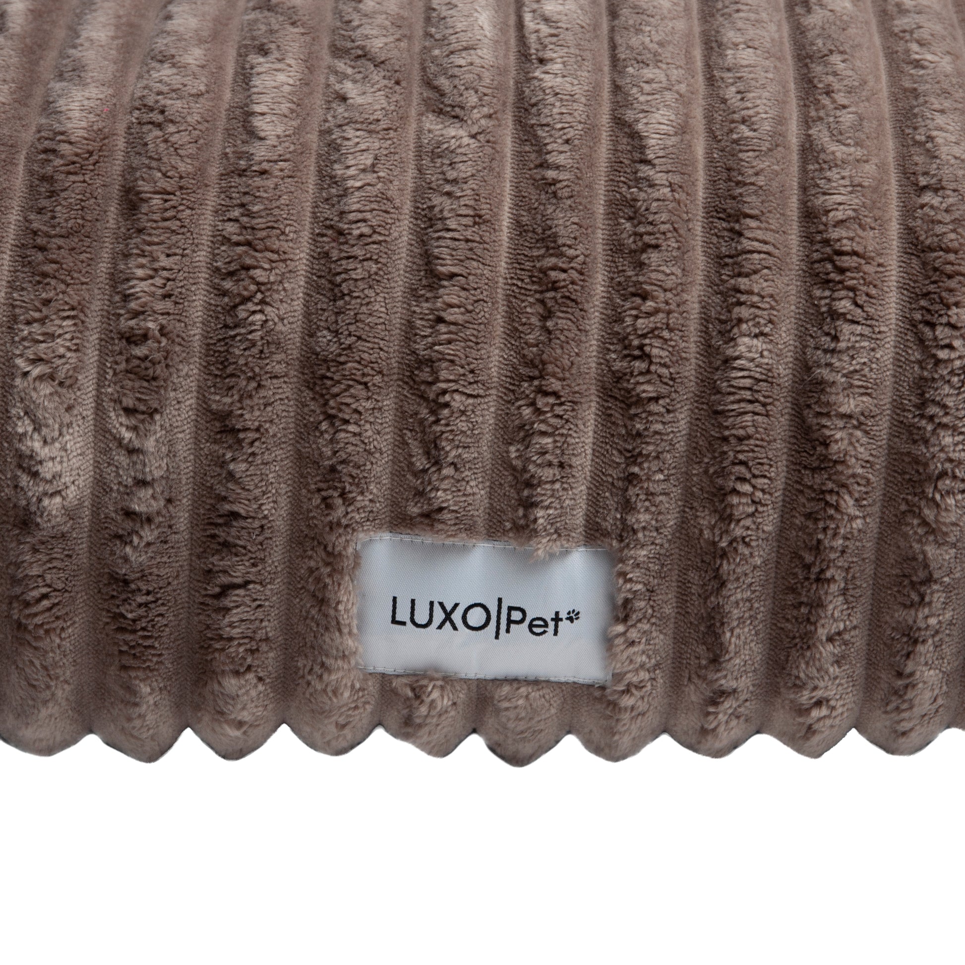 Close-up ribbed fabric texture with brand label