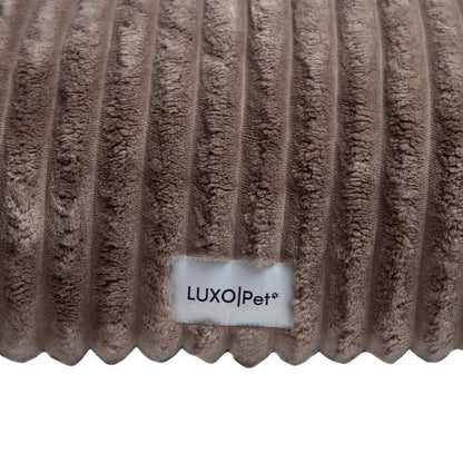 Close-up ribbed fabric texture with brand label
