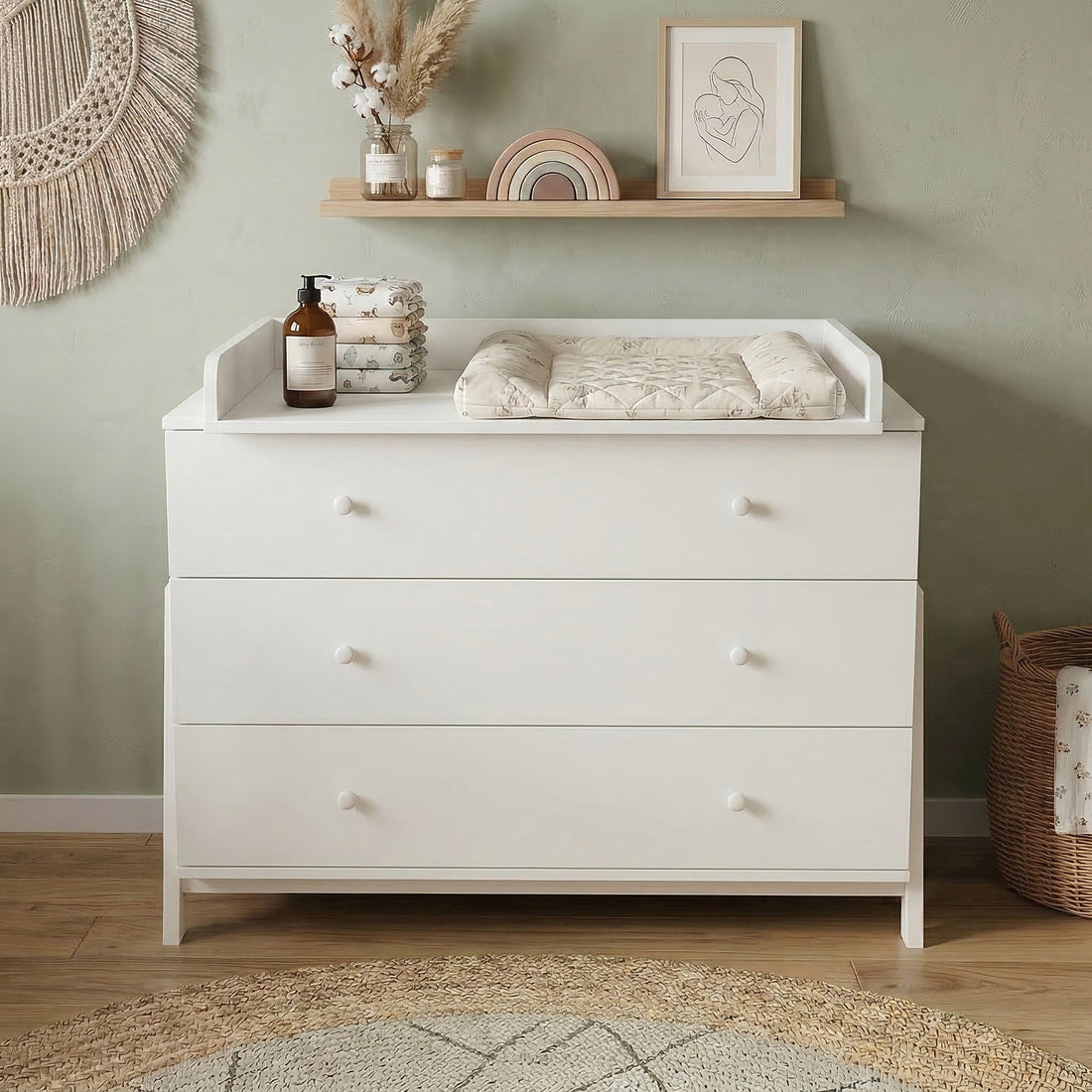 White three-drawer dresser with changing tray styled in boho nursery