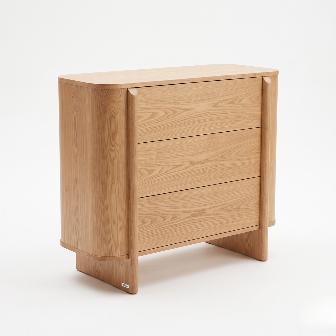 Modern three-drawer wooden dresser on a white background