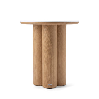 Modern round wooden side table on a white background