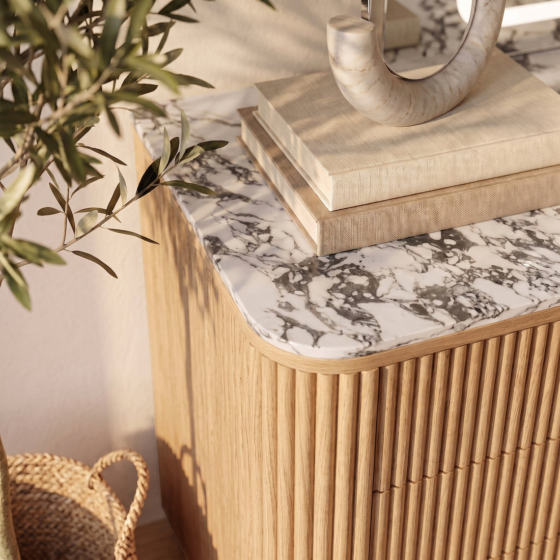 Close view of the top portion of a modern cabinet or sideboard in a styled room