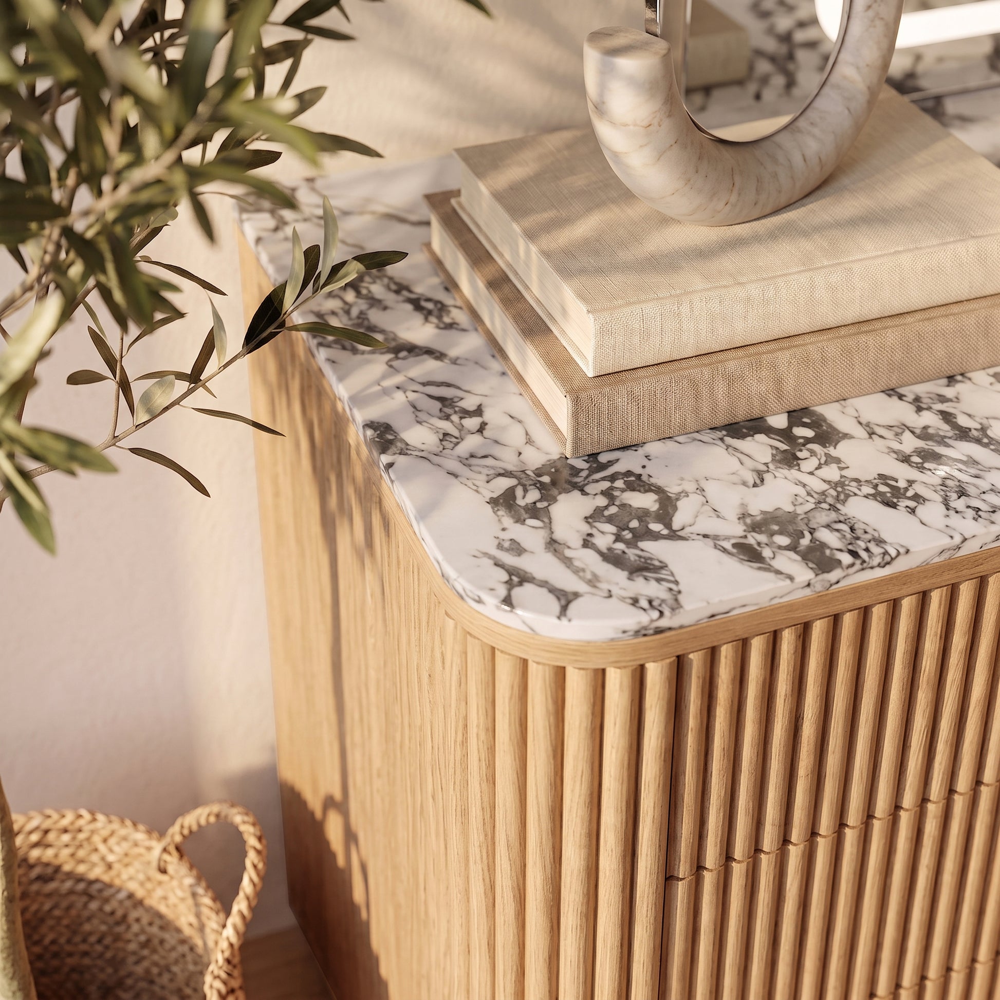 Close view of the top portion of a modern cabinet or sideboard in a styled room