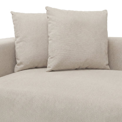Upper section of beige upholstered sofa with two cushions on white background