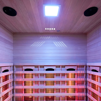 Interior view of a wooden infrared sauna with glowing heating panels