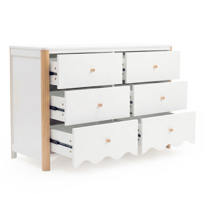 White six-drawer dresser with natural wood accents and partially open drawers on white background