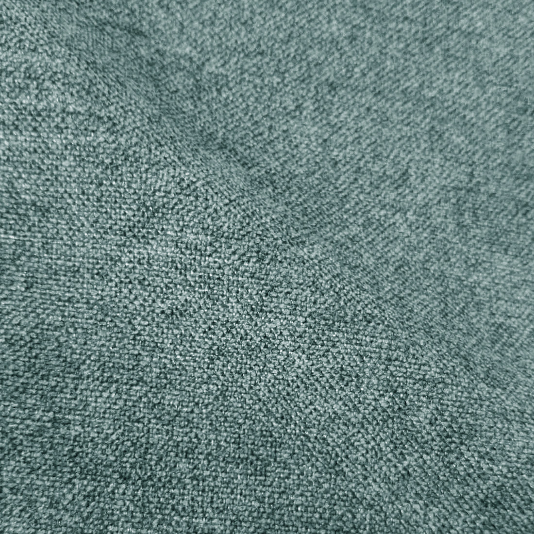 Close-up of textured green woven fabric