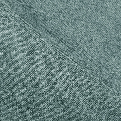 Close-up of textured green woven fabric