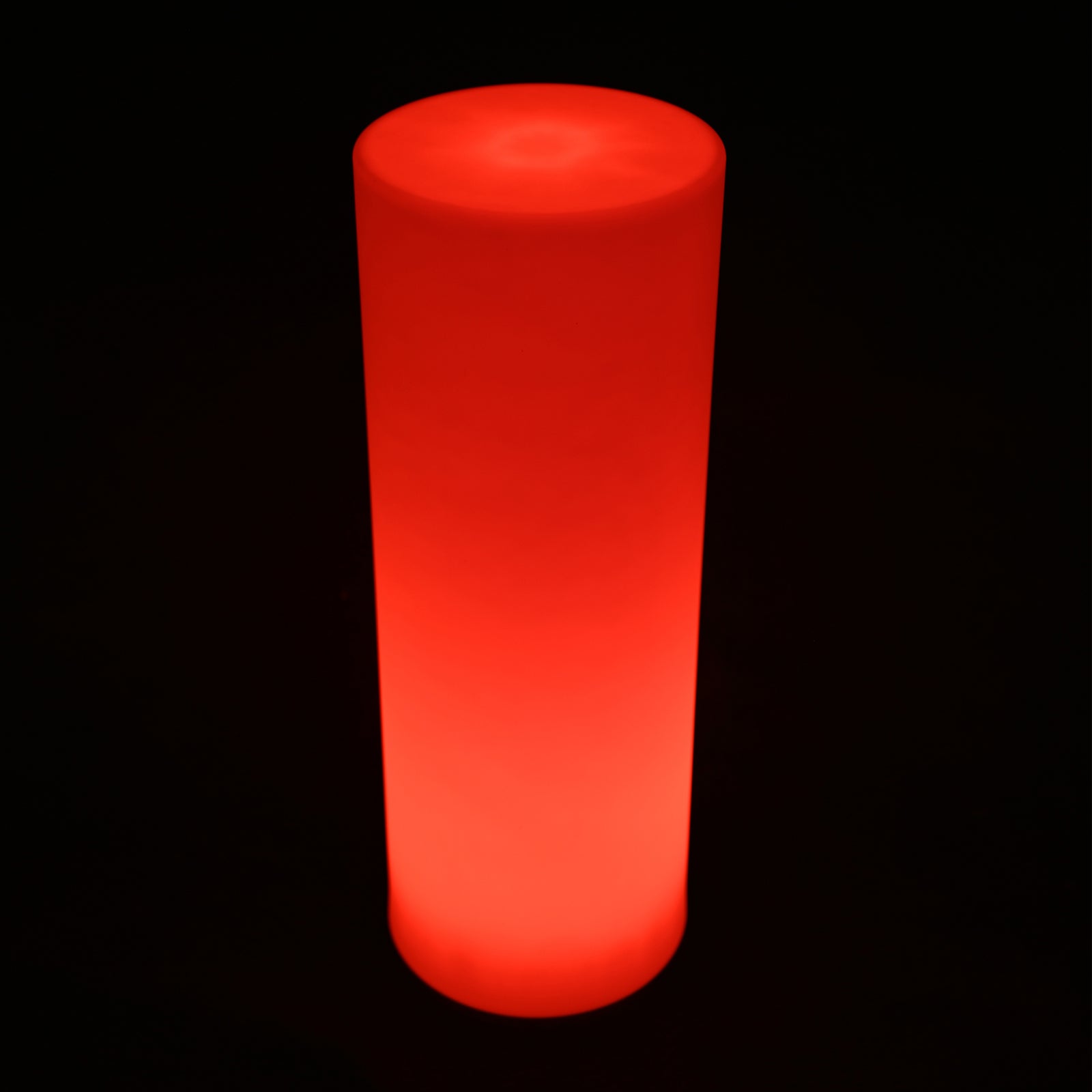 A glowing cylindrical 70cm Outdoor Solar LED Bollard Light, emitting a soft red glow, shown in a dark setting. The light's sleek design enhances outdoor spaces with solar-powered illumination.
