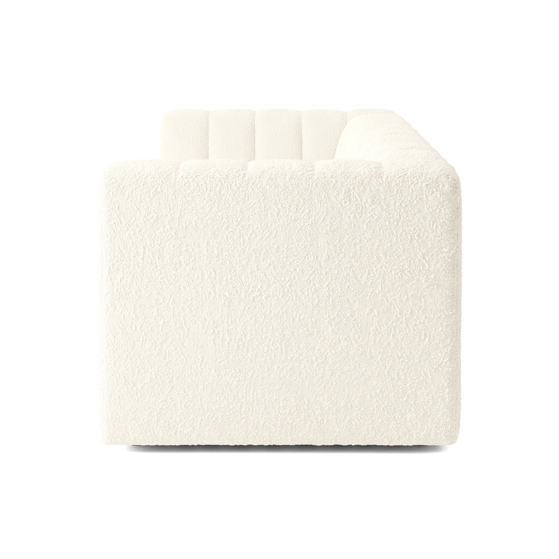 Side view of a cream upholstered sofa on a white background