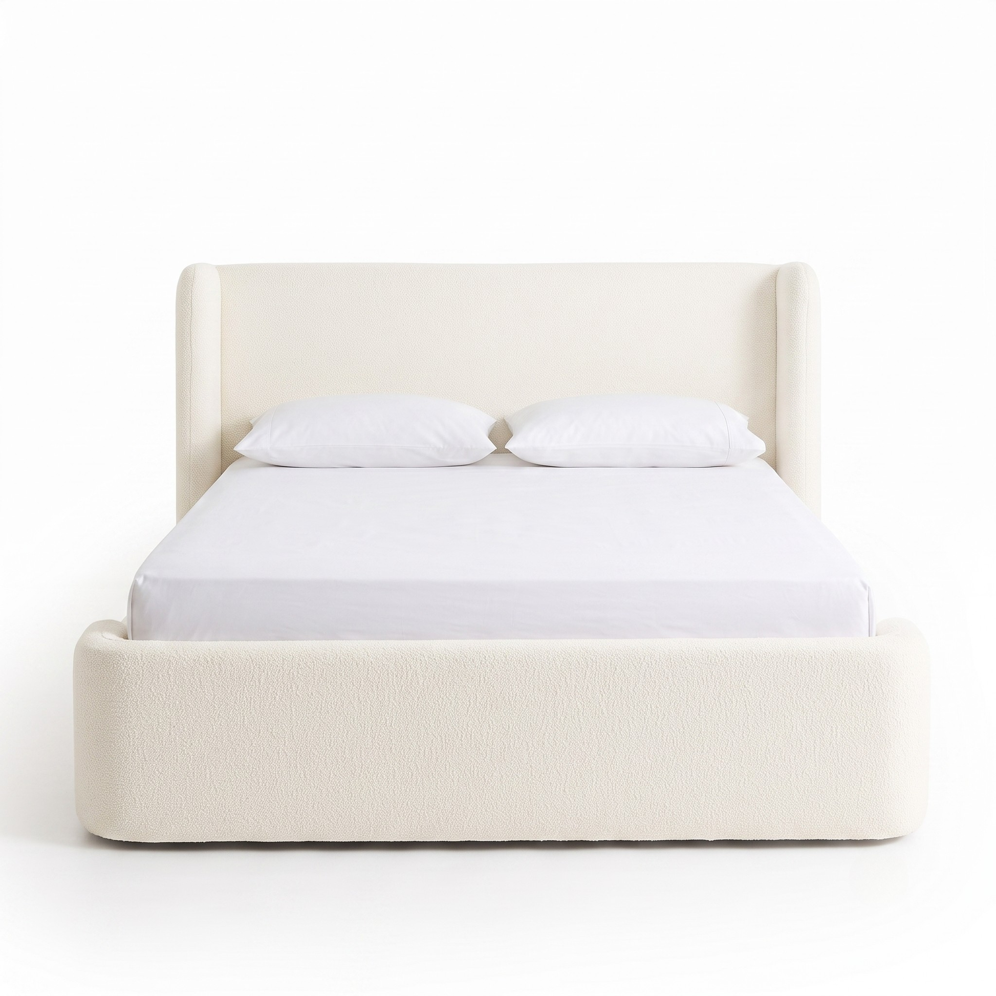 Full upholstered bed on a white background with pillows