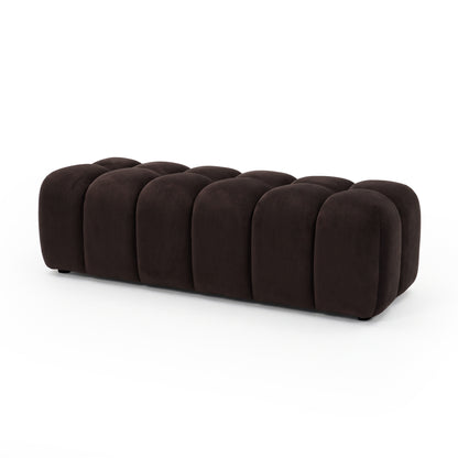 Chocolate brown velvet upholstered ottoman bench on a white background shown in full.