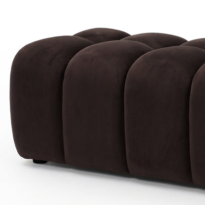 Chocolate brown tufted ottoman bench on a white background, slightly cropped.