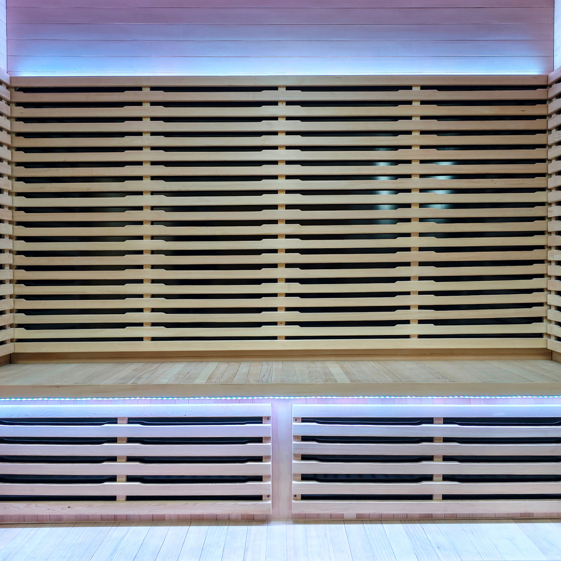 Interior view of a modern sauna with wooden slats and LED lighting