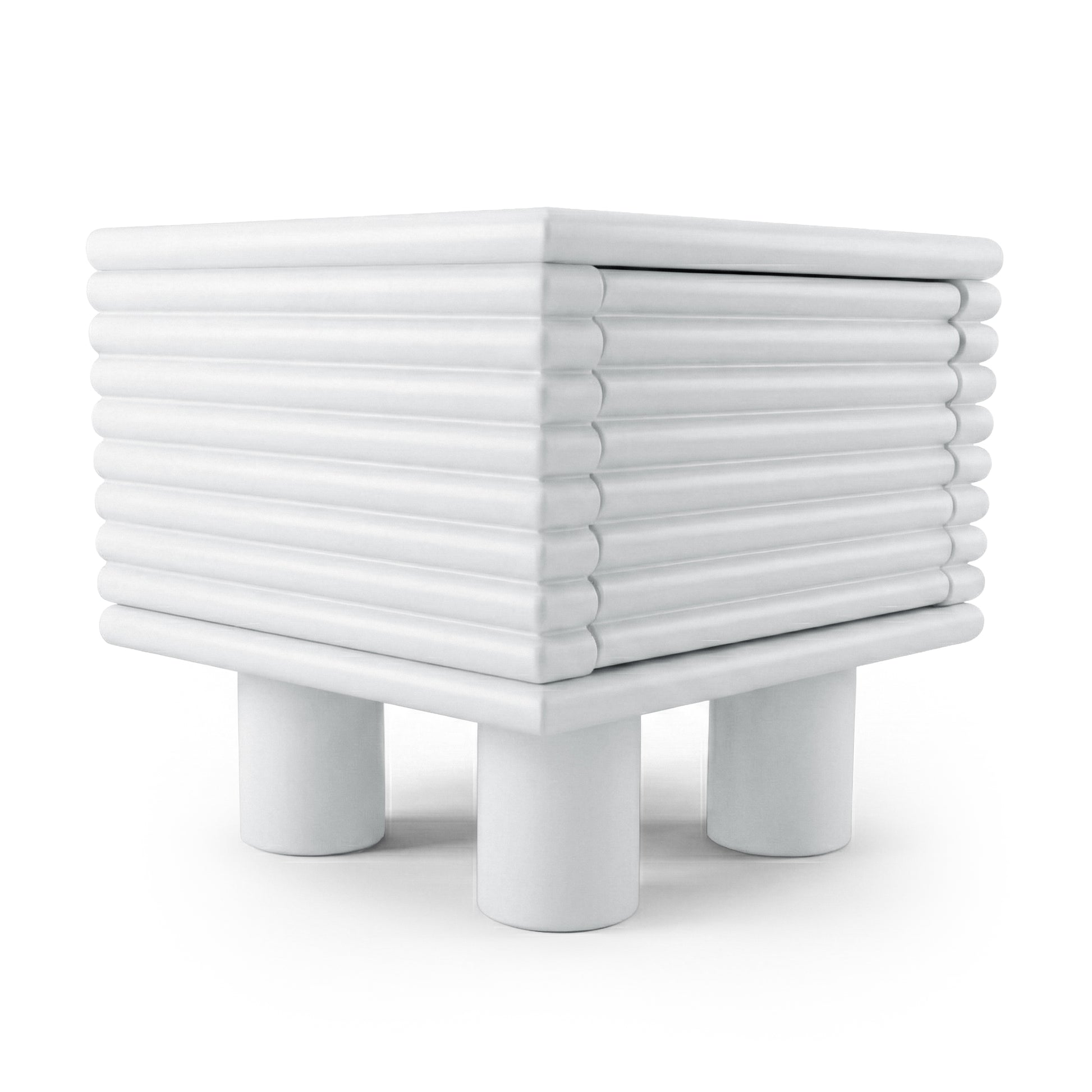 White ribbed side table with four cylindrical legs on white background