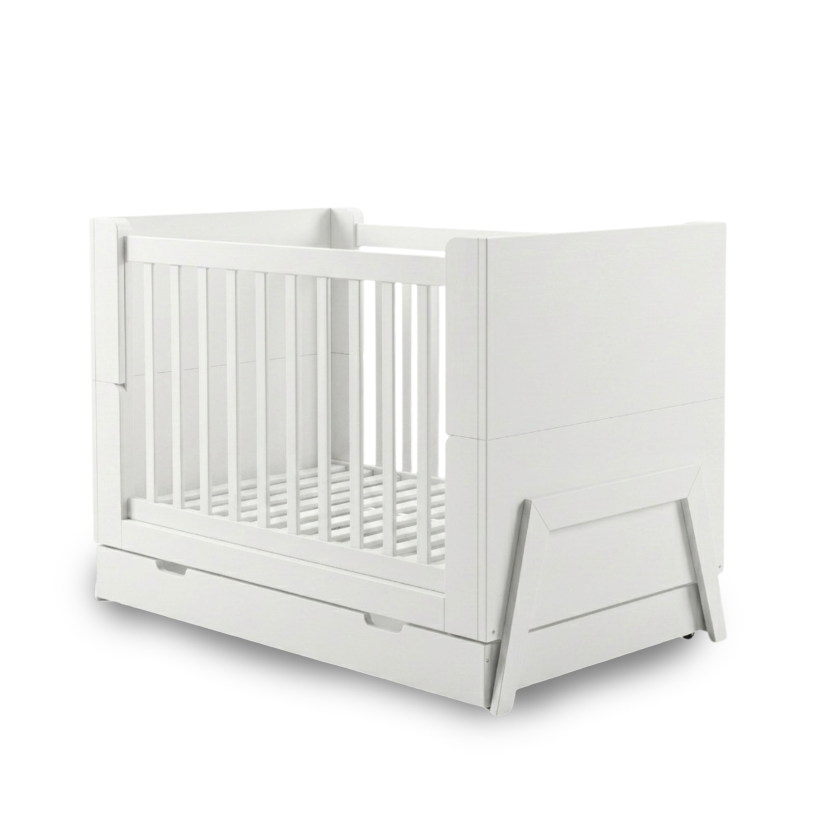 White baby crib on white background showing full product with solid panels, vertical slats, pull-out drawer and angled legs