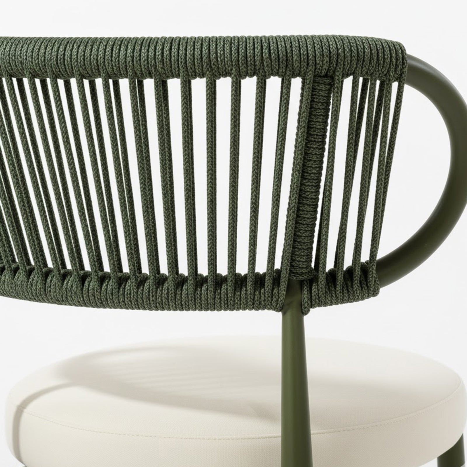 Cabria 9 Piece Sintered Stone Outdoor Dining Set in Green features a modern chair with an olive green, powder-coated metal frame and a backrest of vertical rope strands, paired with an off-white cushion.