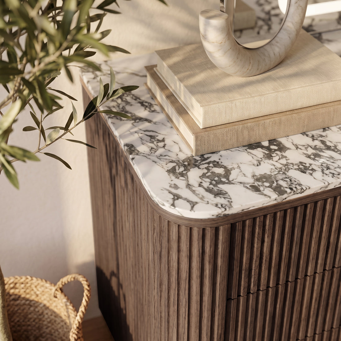 Close-up of a cabinet corner with marble top in a styled room