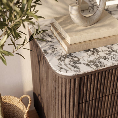 Close-up of a cabinet corner with marble top in a styled room