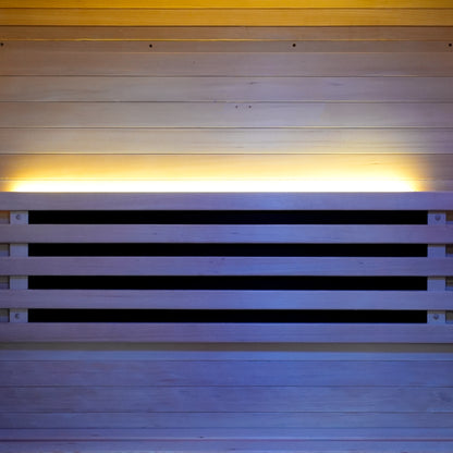 Close-up of wooden sauna wall panel with warm backlighting