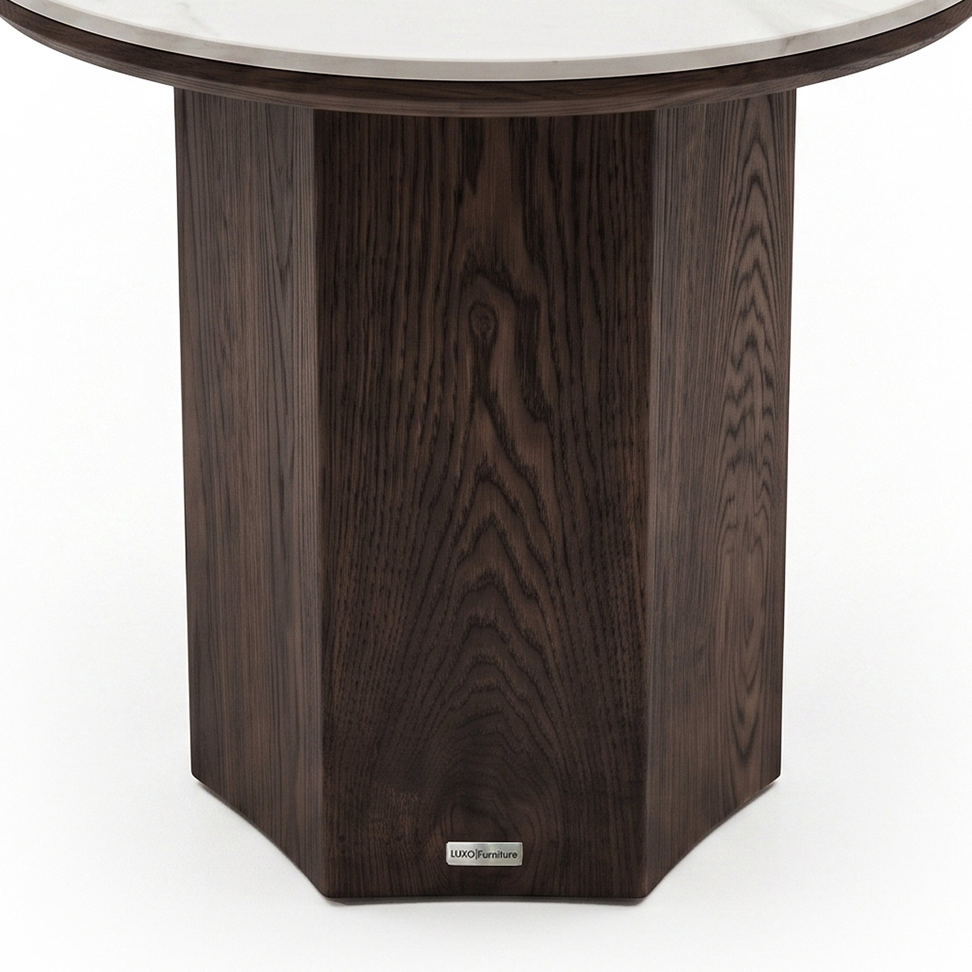 Elegant side table with a dark faceted wooden base and circular glass top on a white background