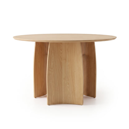 Round wooden dining table on a white background