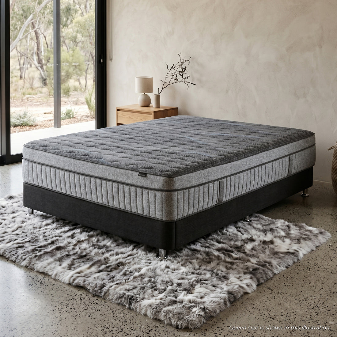 Gray mattress and base in a stylish bedroom setting
