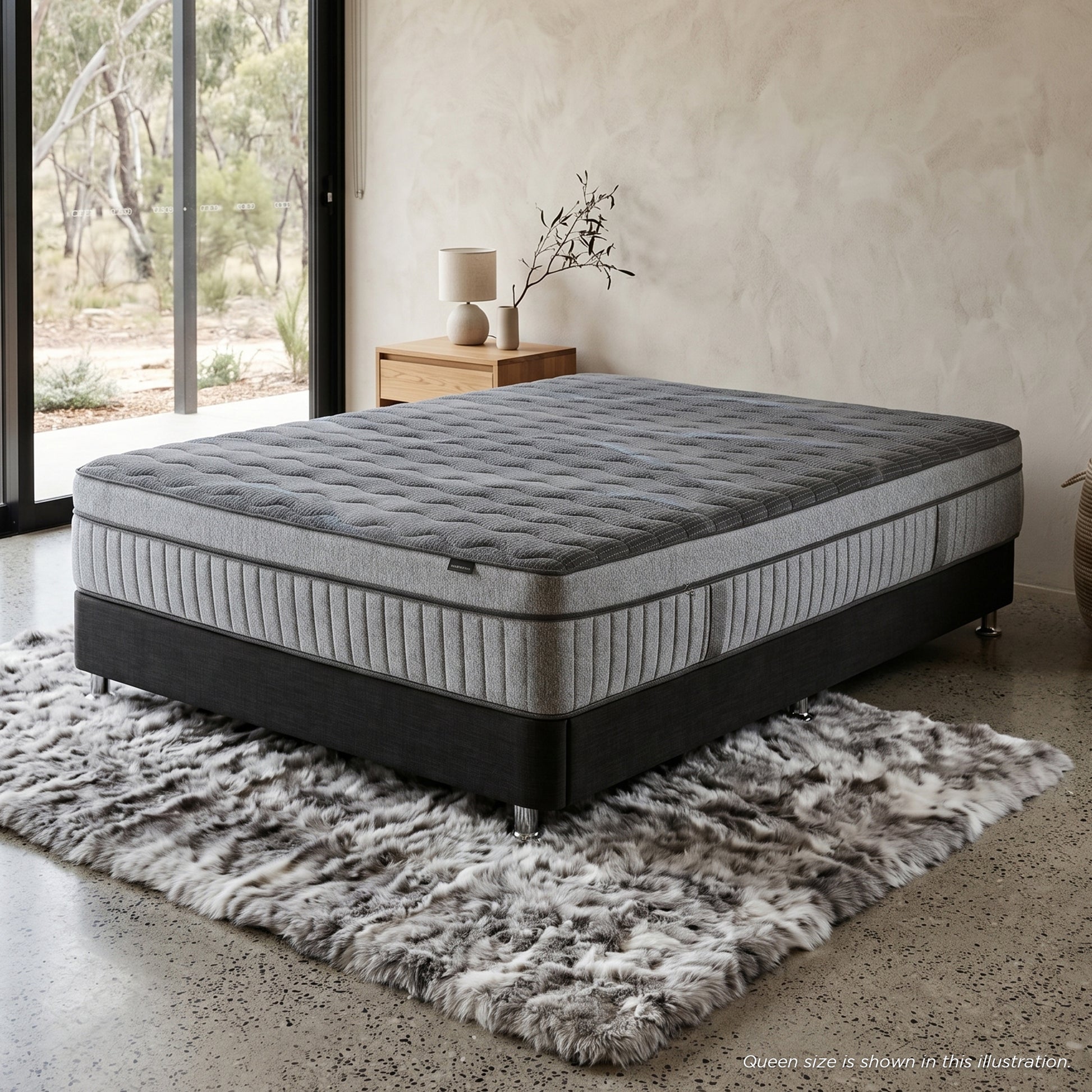 Gray mattress and base in a stylish bedroom setting