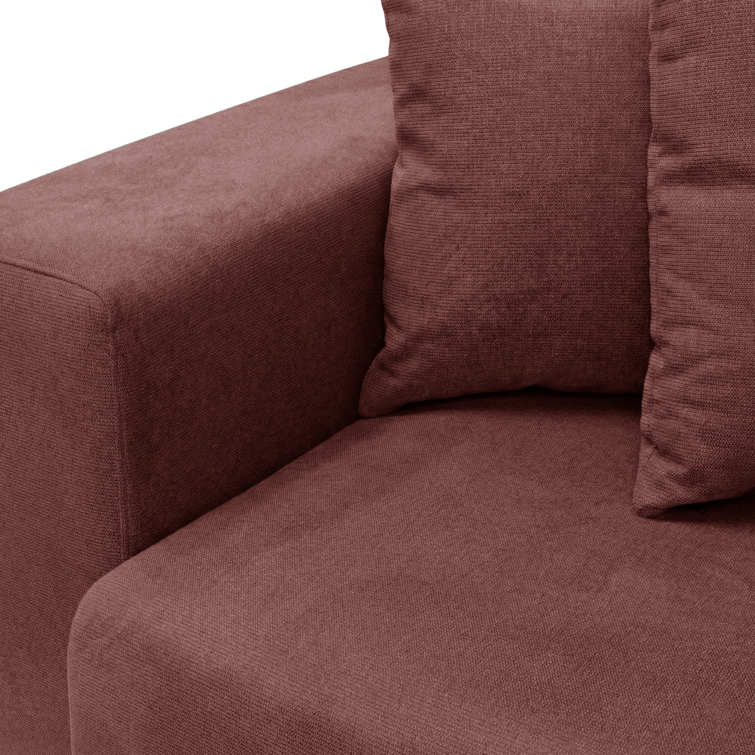 Seat and armrest detail of dusty rose sofa on white background