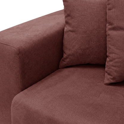 Seat and armrest detail of dusty rose sofa on white background