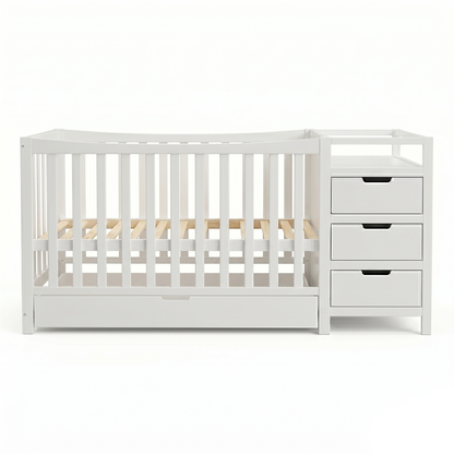 White baby crib with integrated storage drawers on a white background