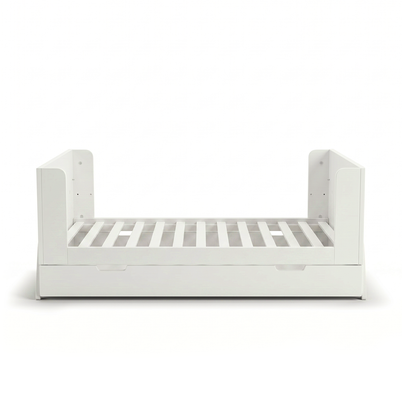 White toddler bed frame on white background with partial guard rails and trundle drawer
