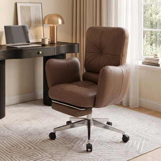 Brown office chair in a stylish home office with desk, lamp, curtains, and window light
