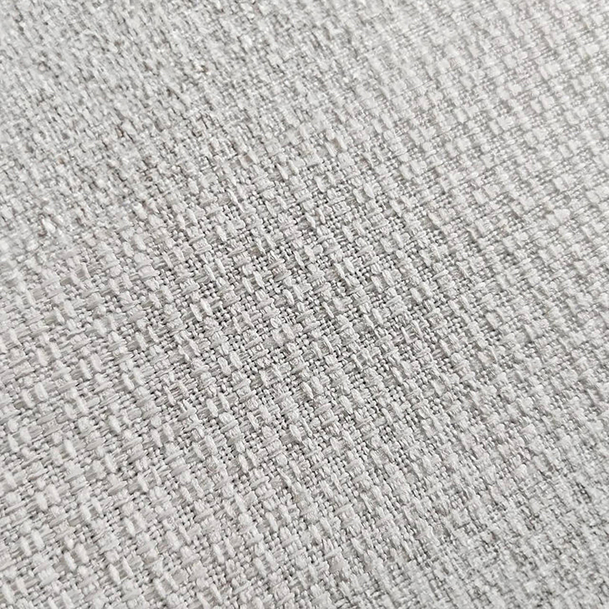 Close-up of textured light beige woven fabric upholstery