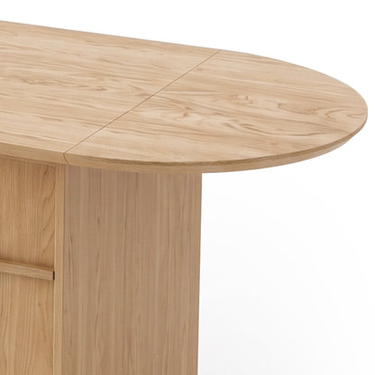 Close-up of a light wood table showing part of the tabletop and base on white background