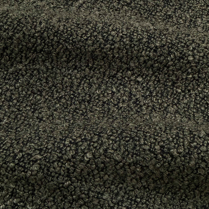 Extreme close-up of dark gray boucle fabric texture