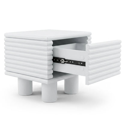 White side table with ribbed exterior and partially open drawer on white background