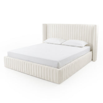 Cream upholstered king-size bed on white background