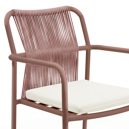 Evone 4 Seater Stone Outdoor Dining Table Set features a sleek stone tabletop, robust aluminium frame, and four armchairs with tubular metal frames and woven rope backs, perfect for alfresco dining.