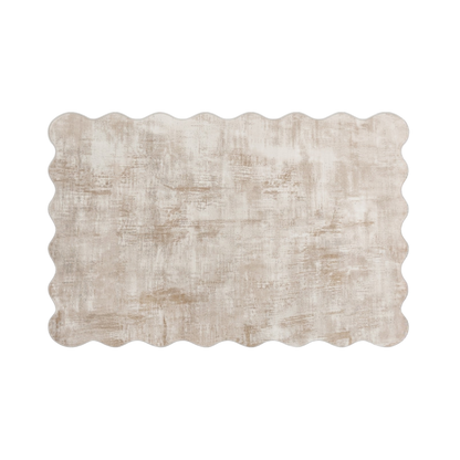 Beige rectangular rug with scalloped edges on a white background