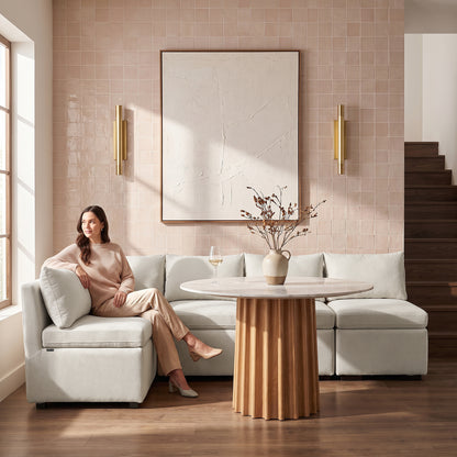 Cream textured sectional sofa styled in a bright modern living room