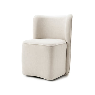 A modern cream upholstered accent chair on a white background