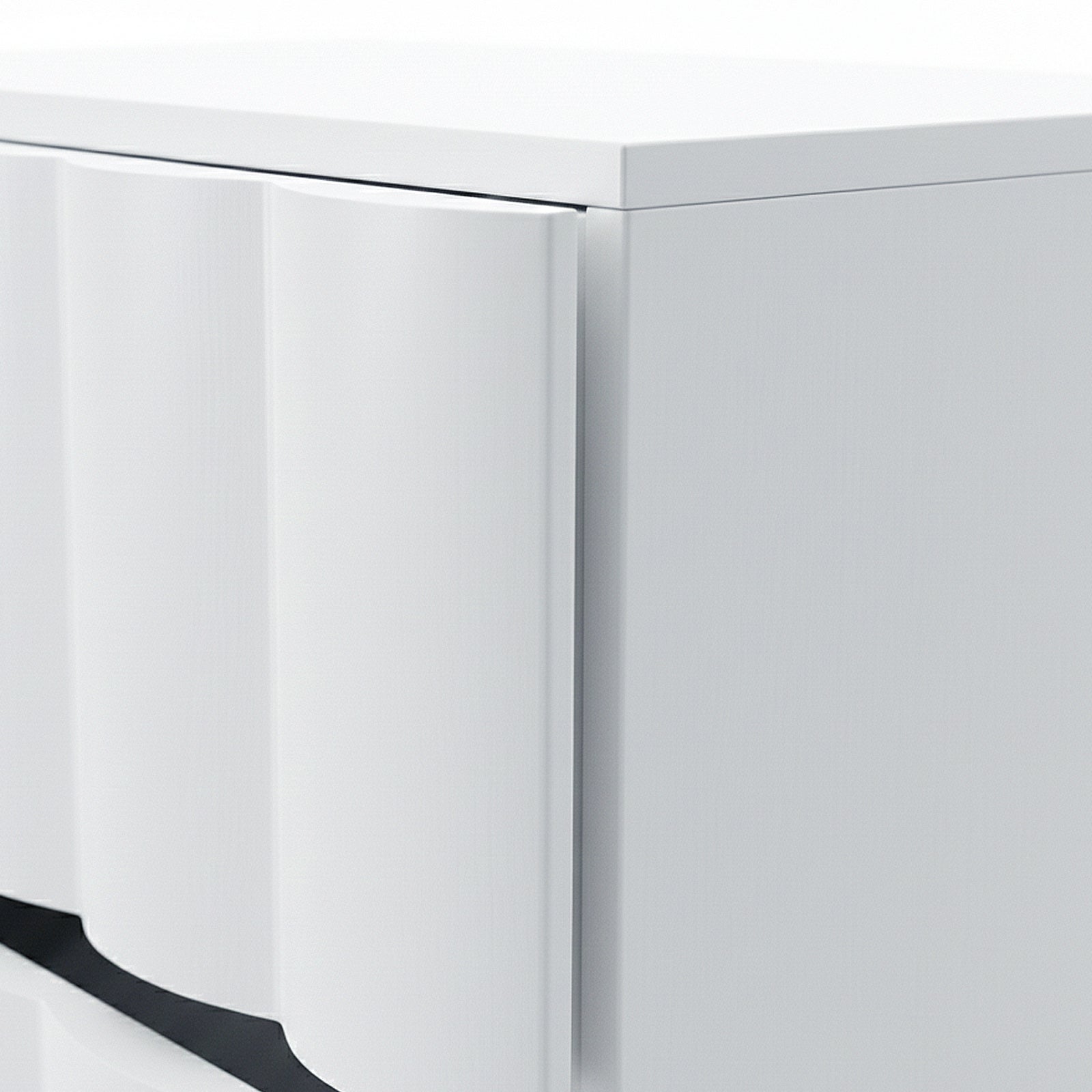 Close-up of textured wave detail on white cabinet